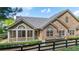 Attractive home featuring a stone and siding facade, complemented by well-manicured landscaping at 5336 Stone Village Nw Cir # 2, Kennesaw, GA 30152