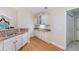 Bright kitchen features granite countertops, hardwood floors, and stainless steel appliances at 5336 Stone Village Nw Cir # 2, Kennesaw, GA 30152