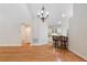 Open living room with hardwood floors and view of kitchen at 5336 Stone Village Nw Cir # 2, Kennesaw, GA 30152