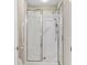 Bright shower with glass doors, grab bars, and a handheld shower head at 5336 Stone Village Nw Cir # 2, Kennesaw, GA 30152