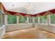 Charming sunroom surrounded by windows, offering abundant natural light and scenic views of the outdoors at 5336 Stone Village Nw Cir # 2, Kennesaw, GA 30152