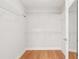 Walk-in closet with wire shelving and a door to the bathroom at 5336 Stone Village Nw Cir # 2, Kennesaw, GA 30152