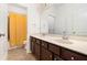 Bathroom featuring a double vanity, framed mirrors, and a separate shower-tub combo with a yellow curtain at 121 Royal Sunset Dr, Dallas, GA 30157