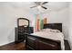 Comfortable bedroom featuring a large bed, dresser, and dark, modern furnishings at 121 Royal Sunset Dr, Dallas, GA 30157