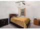 Comfortable bedroom with a ceiling fan, a window, a bed, and matching bedside tables at 121 Royal Sunset Dr, Dallas, GA 30157
