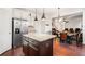 Bright eat-in kitchen featuring granite countertops, stainless steel appliances, and an island with seating at 121 Royal Sunset Dr, Dallas, GA 30157
