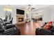 Cozy living area with stone fireplace flows into the dining area and kitchen at 121 Royal Sunset Dr, Dallas, GA 30157