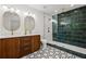 Modern bathroom featuring dual vanity with designer tile floor and glass enclosed shower with decorative tile at 1995 Mcafee Rd, Decatur, GA 30032