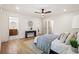 Well-lit bedroom with a modern design, hardwood floors, and multiple doorways leading to other rooms at 1995 Mcafee Rd, Decatur, GA 30032