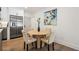 Cozy dining area adjacent to the kitchen featuring stainless steel appliances and modern decor at 1995 Mcafee Rd, Decatur, GA 30032