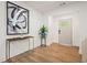 Bright entryway with hardwood floors, elegant console table, and modern artwork at 1995 Mcafee Rd, Decatur, GA 30032