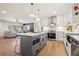 Stylish kitchen featuring a gray island with stainless steel appliances and a bright, open living area at 1995 Mcafee Rd, Decatur, GA 30032