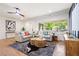 Bright living room featuring hardwood floors, comfortable seating, and a large window at 1995 Mcafee Rd, Decatur, GA 30032