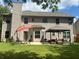 View of a two-story house with a patio, gazebo and manicured lawn at 200 Birchwood Dr, Loganville, GA 30052