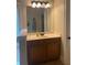 Bathroom vanity with a large mirror and natural light at 200 Birchwood Dr, Loganville, GA 30052
