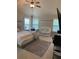 Bright bedroom with plush carpet, crib, and large windows at 200 Birchwood Dr, Loganville, GA 30052