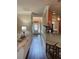 Inviting hallway with wood floors, paneled walls, and decorative lighting at 200 Birchwood Dr, Loganville, GA 30052