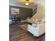Inviting living room with hardwood floors, ceiling fan, and comfortable seating arrangement at 200 Birchwood Dr, Loganville, GA 30052