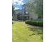Two story home featuring a manicured lawn and lush landscaping at 200 Birchwood Dr, Loganville, GA 30052