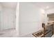 Bright hallway featuring neutral walls, carpet, and access to bedrooms and other living spaces at 2140 Ravencliff Dr, Austell, GA 30168