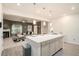 Kitchen area featuring an island with seating, pendant lights, and modern appliances at 2140 Ravencliff Dr, Austell, GA 30168