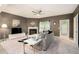Cozy living room with a fireplace, stylish furniture, and ample natural light at 2140 Ravencliff Dr, Austell, GA 30168