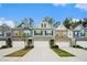 Attractive exterior of newly built townhomes showcasing varied colors and attached garages at 2140 Ravencliff Dr, Austell, GA 30168