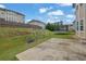 Spacious backyard featuring a trampoline, swing set, and patio at 2740 Longacre Park Way, Lawrenceville, GA 30044