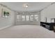 Bonus room offering a spacious layout and multiple windows at 2740 Longacre Park Way, Lawrenceville, GA 30044