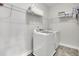Practical laundry room equipped with a washing machine and dryer at 2740 Longacre Park Way, Lawrenceville, GA 30044