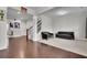 This living room features hardwood floors flowing into carpet with many windows and a staircase to the next floor at 2740 Longacre Park Way, Lawrenceville, GA 30044