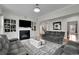 Spacious living room with fireplace, grey sofas, and a view to the entryway at 2740 Longacre Park Way, Lawrenceville, GA 30044