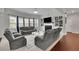 Inviting living room with built-in shelves, fireplace, and grey sofas for relaxation at 2740 Longacre Park Way, Lawrenceville, GA 30044