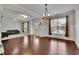 This living room features hardwood floors flowing into carpet with many windows at 2740 Longacre Park Way, Lawrenceville, GA 30044