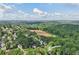 Community aerial featuring established trees and lush landscaping near entertainment and commercial offerings at 1097 Soaring Way, Marietta, GA 30062