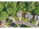 Aerial view shows the layout of the property, including its position in the neighborhood and wooded surroundings at 1097 Soaring Way, Marietta, GA 30062