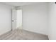 Carpeted basement room with white walls and a door leading to another area of the house at 1097 Soaring Way, Marietta, GA 30062