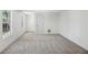 Finished basement featuring carpeted floors, white walls, and natural light from two windows at 1097 Soaring Way, Marietta, GA 30062