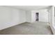 Large carpeted basement area with a white ceiling, white walls, and a doorway to another room at 1097 Soaring Way, Marietta, GA 30062
