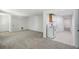 Spacious finished basement with carpet, white walls, and a kitchenette with a white electric range at 1097 Soaring Way, Marietta, GA 30062