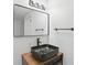 Stylish bathroom featuring a vessel sink, black fixtures, and modern mirror with lighting at 1097 Soaring Way, Marietta, GA 30062