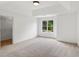 Spacious carpeted bedroom with natural light and walk-in closet at 1097 Soaring Way, Marietta, GA 30062