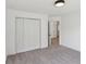 Bright bedroom features neutral carpeting, spacious closet, and modern lighting at 1097 Soaring Way, Marietta, GA 30062