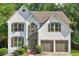 Charming two-story stucco home with a well-manicured lawn and attached two-car garage at 1097 Soaring Way, Marietta, GA 30062