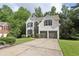 Charming two-story home with a two-car garage and well-maintained front yard at 1097 Soaring Way, Marietta, GA 30062