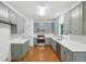 Kitchen with gray shaker cabinets, stainless steel appliances, and white countertops at 1097 Soaring Way, Marietta, GA 30062