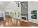 Bright open concept with a fireplace flowing into a kitchen with shaker cabinets at 1097 Soaring Way, Marietta, GA 30062