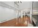 Open-concept living space featuring hardwood floors, modern lighting and a fireplace at 1097 Soaring Way, Marietta, GA 30062