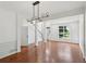 Open-concept living space featuring hardwood floors, fresh white walls and modern lighting at 1097 Soaring Way, Marietta, GA 30062
