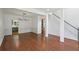 Bright living space featuring hardwood floors, modern lighting and fresh white walls, adjacent to staircase at 1097 Soaring Way, Marietta, GA 30062